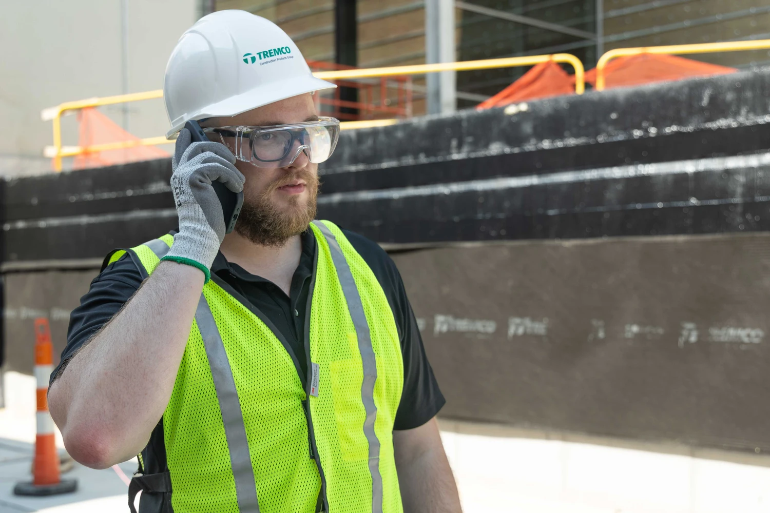 Construction worker on the phone on a construction site.