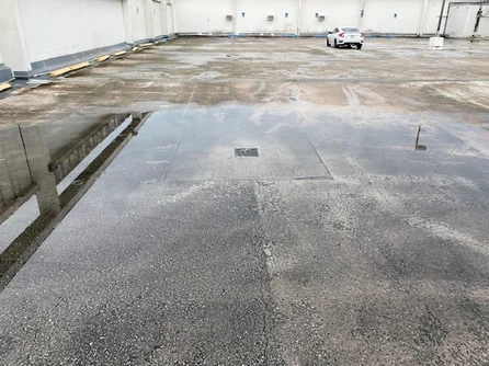 Ponding water on concrete due to inadequate drainage and/or improper sloping.