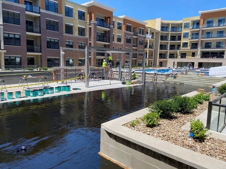 A concrete pool floor treated with Tremco's fluid-applied waterproofing membrane.