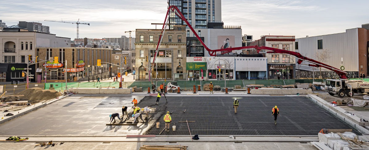 Waterproofing restoration of this podium deck was a unique challenge due to the seasonal amenities it houses, including an ice rink and fountain.
