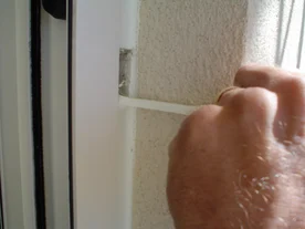 Alternate view of a pull-off test checking for sealant adhesion.