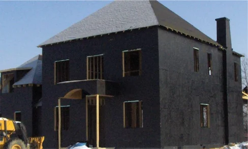 A water-resistant barrier (WRB) is displayed on the exterior of a residential home under construction before the installation of final cladding and overlay.